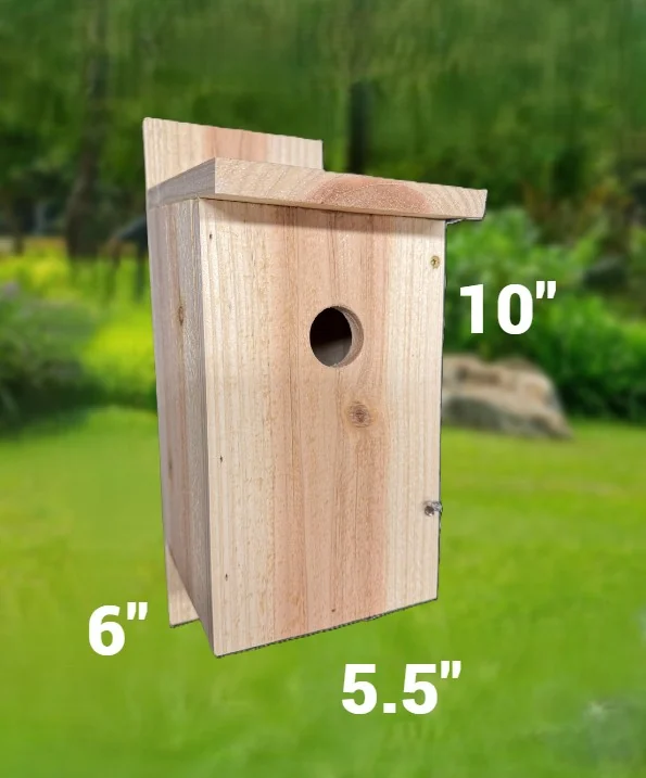 Wooden birdhouse with a pitched overhanging roof and a round entry hole.