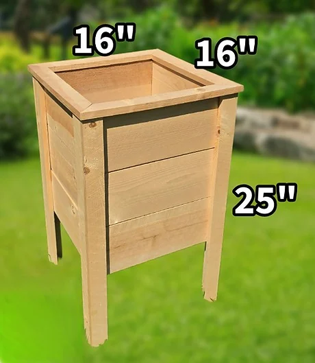 Tall wooden planter box on long corner legs.