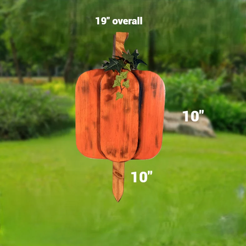 Smaller orange-stained wooden pumpkin yard stake with a curled stem and ivy.